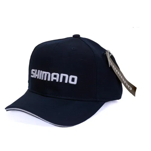 Gorra de béisbol azul marino con la etiqueta "Gorro Shimano Azul FT9691" y la palabra "SHIMANO" bordada en blanco en la parte delantera. La gorra tiene una visera curva con un borde blanco y una etiqueta en la parte posterior que también muestra el nombre de la marca.