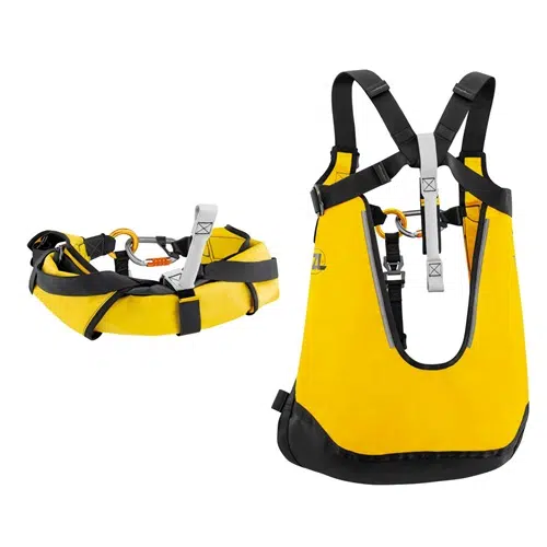 Imagen del arnés de rescate Petzl Thales en amarillo y negro. Este arnés cuenta con correas y clips ajustables, mientras que el cinturón incluye una hebilla metálica y presillas para enganches. Está diseñado para brindar seguridad y apoyo en operaciones de rescate.