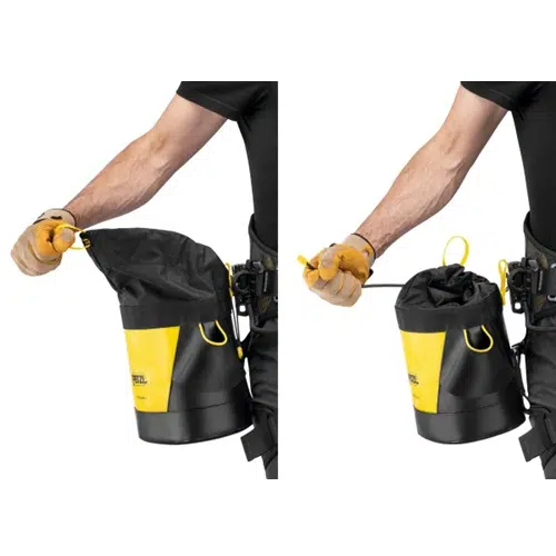 La imagen muestra a una persona que muestra el proceso de apertura y cierre de la Bolsa Portaherramientas Petzl Toolbag 6 en negro y amarillo. Con los guantes puestos, la bolsa de herramientas está bien sujeta al cinturón, mostrando su espacioso compartimento abierto por un lado y perfectamente cerrado por el otro.