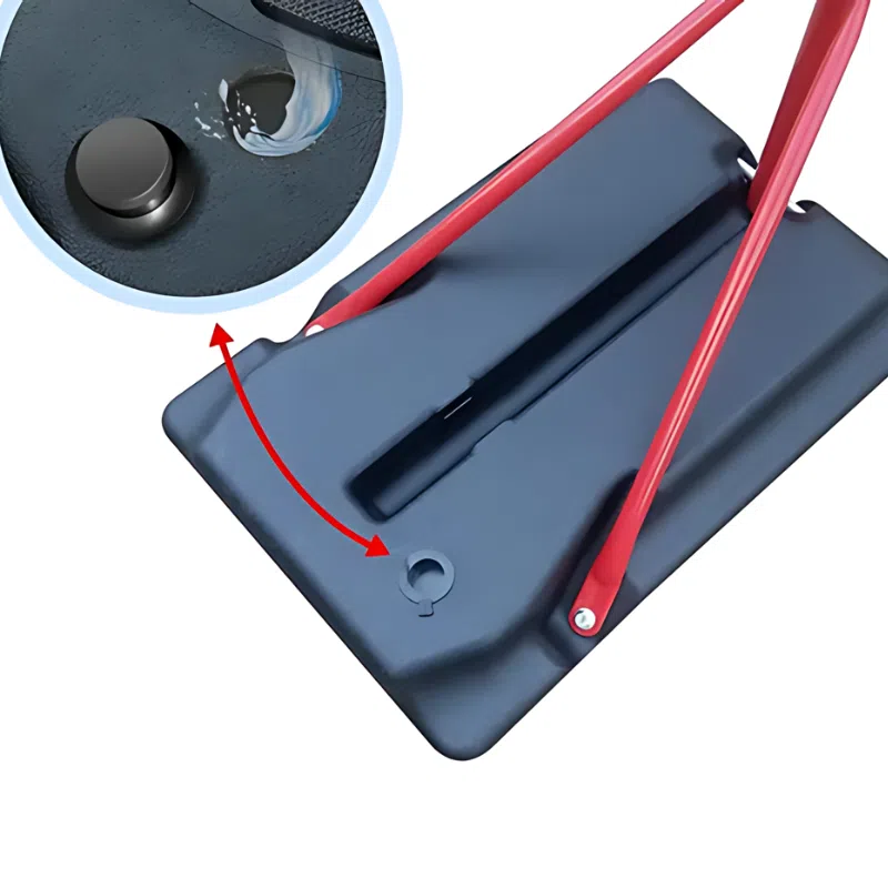 Primer plano de un asa roja unida a la base negra del Aro Básquetbol Uk Time Sport con Pedestal S881A para Niños. Un círculo insertado muestra una gota de agua que impacta un pequeño componente circular en la base, con una flecha que enfatiza esta característica distintiva.