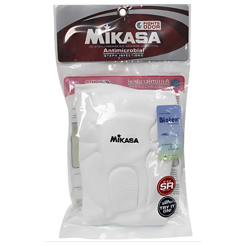 El embalaje de las rodilleras profesionales senior de Rodilleras Voleibol MIKASA cuenta con tecnología antimicrobiana y antiolores, además de un paquete de muestra del eliminador de olores de ropa Blocier. El embalaje, principalmente blanco, muestra de forma destacada la marca Rodilleras Voleibol MIKASA.