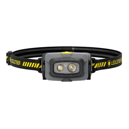 La Linterna Frontal Led Lenser HF4R Work 500lm es una linterna frontal LED negra y amarilla que cuenta con dos lentes de luz y una diadema ajustable con "LEDLENSER" impreso en ella.