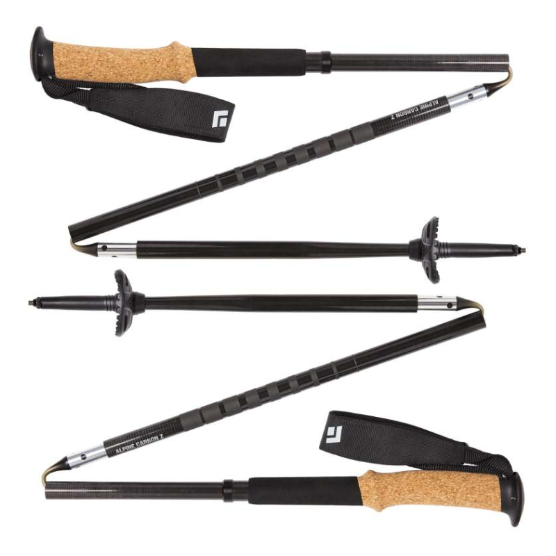 Dos bastones de trekking negros plegables con empuñaduras de corcho y correas para las muñecas, totalmente extendidos. Los bastones tienen puntas puntiagudas y cestas para la nieve, diseñados para practicar senderismo y aventuras al aire libre.