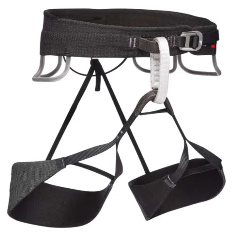 El arnés Arnés Black Diamond Solution Guide está equipado con presillas ajustables en la cintura y las piernas, correas duraderas, una hebilla de metal y presillas para el material de escalada. Este arnés negro, que se muestra sobre un fondo blanco, ofrece a los escaladores la combinación perfecta de fiabilidad y comodidad.