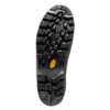 La imagen muestra la suela de una bota de trekking La Sportiva Trango Trk Leather GTX negra con dibujo profundo y resistente. Un logotipo geométrico amarillo está en el centro, lo que resalta el agarre fuerte y la durabilidad para aventuras al aire libre.