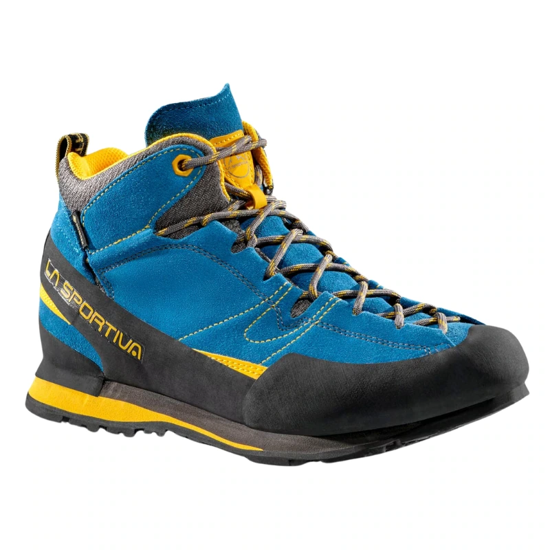 Presentamos la zapatilla de aproximación La Sportiva Boulder X Mid GTX, una elegante zapatilla de senderismo de caña alta en azul y amarillo. Cuenta con cordones grises, una puntera reforzada en negro y luce con orgullo el nombre de la marca La Sportiva en el lateral para ofrecer estilo y durabilidad.