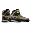 Un par de botas de montaña La Sportiva TX5 GTX Mujer en color beige, negro y gris con detalles en amarillo, tobillos altos, suelas gruesas y un diseño con cordones sobre un fondo blanco.