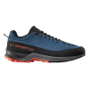La zapatilla de aproximación de cuero La Sportiva TX Guide presenta un diseño resistente con una parte superior azul, detalles negros, cordones rojos, suela naranja y una marca naranja brillante en el lateral, perfecta para tus aventuras al aire libre.
