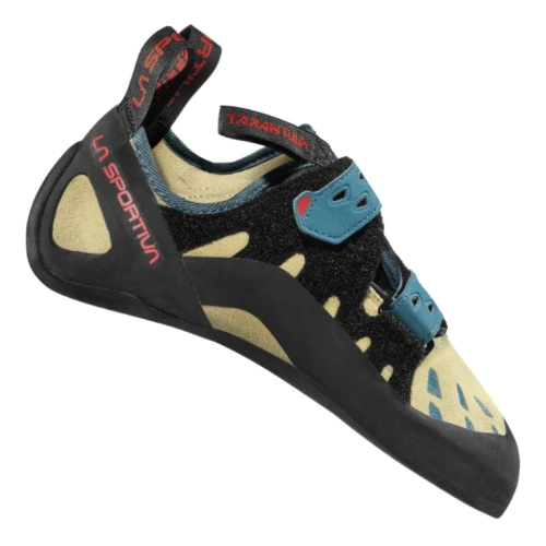 El zapato de escalada La Sportiva Tarantula Mujer cuenta con un diseño único en negro y amarillo, correas de velcro azules, una marca roja llamativa, una suela de goma duradera y conserva la silueta clásica familiar para los escaladores de todo el mundo.