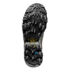 La imagen muestra una suela de bota de senderismo negra con tacos profundos y un logotipo Vibram, lo que indica tracción y durabilidad similar a las Zapatillas de Montaña La Sportiva Ultra Raptor II Leather GTX, ideal para terrenos difíciles.