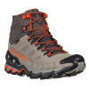 La bota de senderismo para mujer, Zapatilla de Trekking La Sportiva Ultra Raptor II Mid Leather GTX Mujer, presenta un diseño resistente con tonos beige y grises, detalles y cordones naranjas, un corte de tobillo alto, suela con dibujo y marca visible.