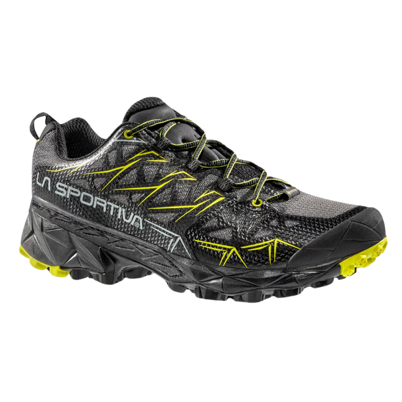 Descubre la zapatilla de aproximación La Sportiva Akyra GTX, una zapatilla de trail negra y amarilla con suela resistente. Presenta la marca "La Sportiva" en el lateral y ofrece superficies texturizadas y detalles en amarillo brillante en los cordones y la banda de rodadura para darle estilo.