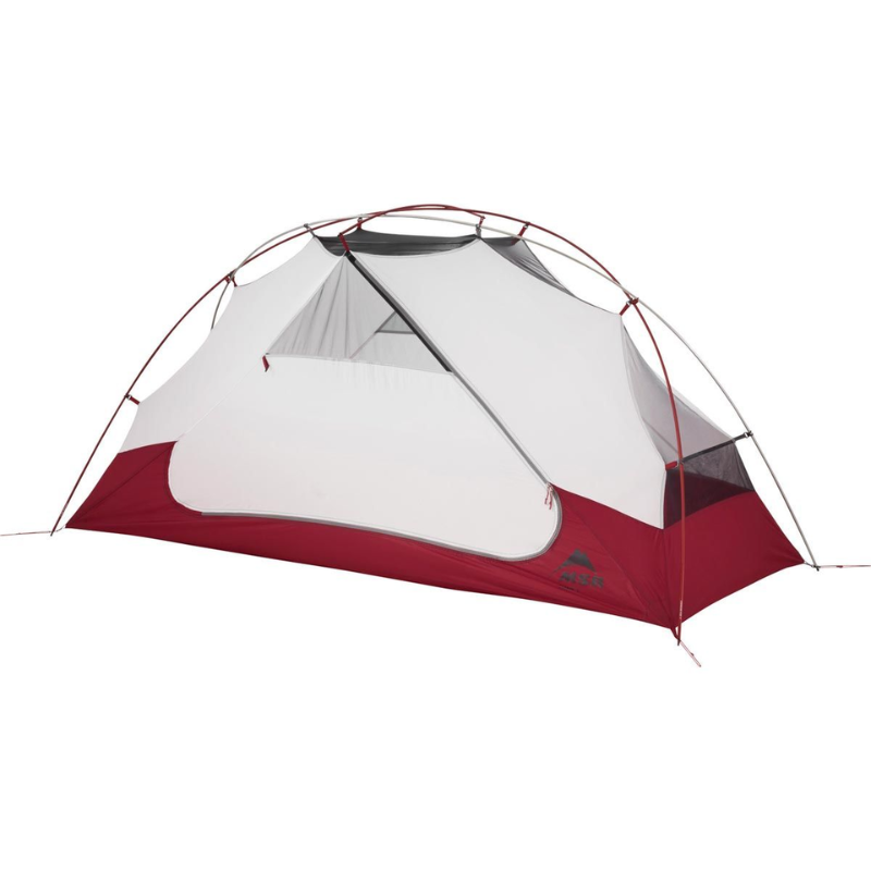 La Carpa MSR Elixir 1 es una carpa ligera con forma de cúpula, de color rojo y blanco, con paneles de malla. Con dos postes que se entrecruzan para brindar un soporte firme y una entrada frontal, es perfecta para aventuras al aire libre.