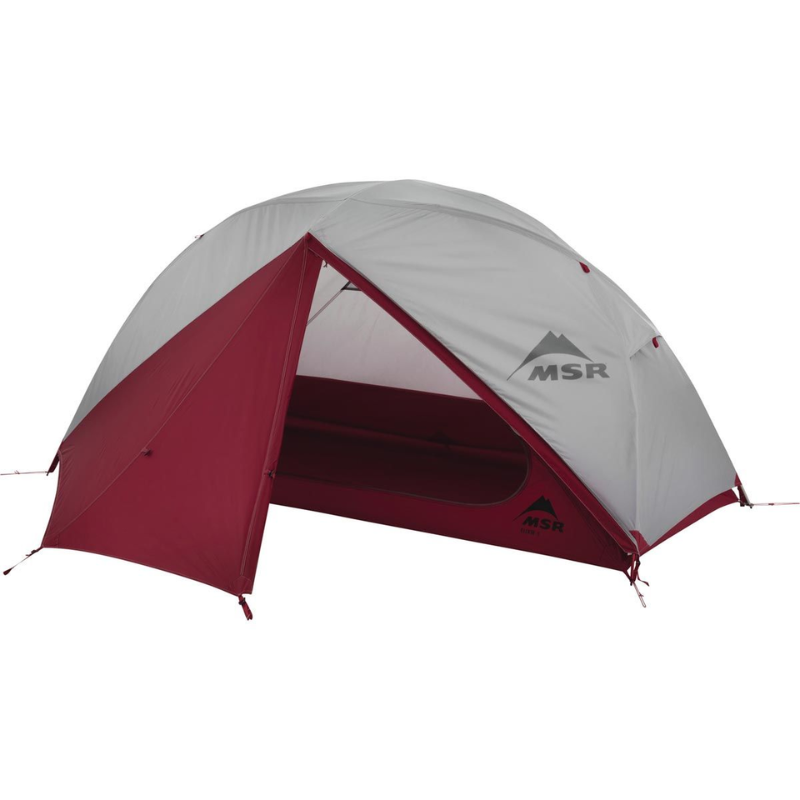 La Carpa MSR Elixir 1 es una tienda de campaña en forma de cúpula de color gris y rojo con el logotipo de MSR, ideal para viajes en solitario. Tiene un frente parcialmente abierto, lo que invita a explorar su acogedor interior. Presentada sobre un fondo blanco, resalta su elegante diseño.