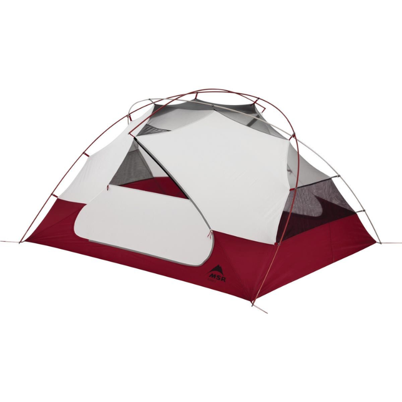La Carpa MSR Elixir 2 (copia) es una tienda de campaña ligera con tela roja y blanca, que cuenta con una entrada grande, ventilación de malla y una estructura de cúpula independiente con postes flexibles, ideal para acampar y realizar aventuras con mochila.