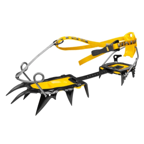 Los Crampones de Alpinismo Técnico Grivel G22 Plus (copia) son de color amarillo y negro con puntas de metal y correas ajustables, ideales para asegurar a las botas durante escaladas desafiantes.