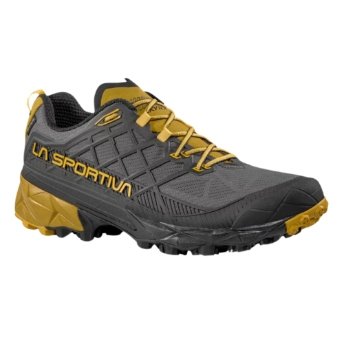 Conoce la zapatilla de Mountain Running La Sportiva Akyra II GTX, una zapatilla de trail gris y amarilla con banda de rodadura multidireccional y cordones de un amarillo vibrante. Con la palabra "La Sportiva" en el lateral, su diseño duradero es ideal para carreras aventureras.