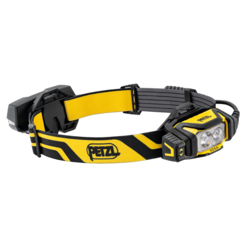 Linterna frontal Petzl amarilla y negra con función de luz dual y correa ajustable. El logotipo es visible en la correa. El diseño es resistente, adecuado para uso en exteriores o en el trabajo.