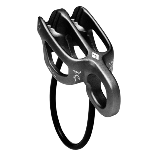 La guía Asegurador Black Diamond ATC-Guide en color negro, con ranuras para cuerda y un gran orificio ovalado, se muestra en ángulo sobre un fondo blanco.