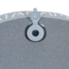 Primer plano de la Almohada Inflable Atakama Outdoor Baker, un objeto metálico circular con un pequeño accesorio blanco y un botón en la parte superior. Su superficie texturizada incluye inscripciones blancas parcialmente visibles, ideal para las aventuras de Atakama Outdoor.